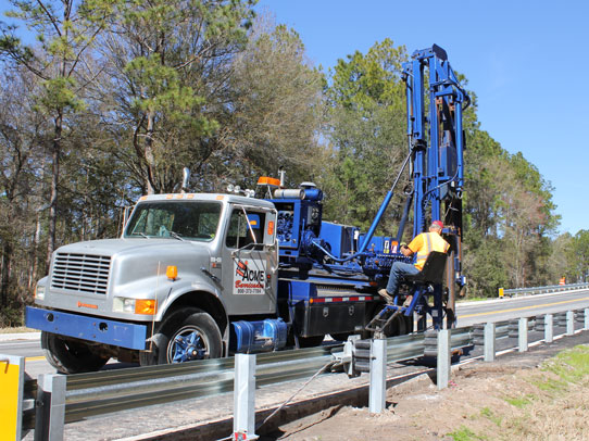 Acme Barricades Employee Installing Metal Guardrails