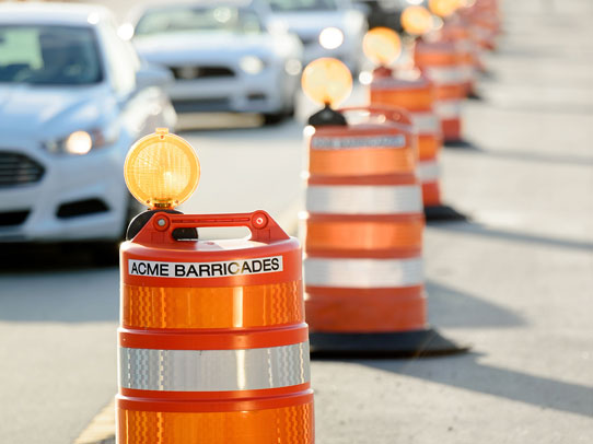 Acme Barricades orange barrels used as temporary traffic control in Jacksonville